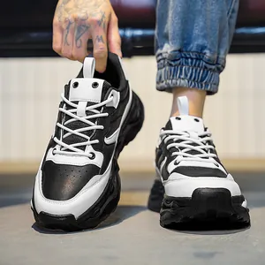 Men's fashion low-top platform sneakers in black and white leather with chunky rubber soles