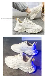 Detailed close-up of cream chunky sneakers with layered panels and thick wavy soles