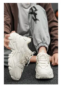 Close-up of retro chunky sneakers for men with thick soles and mesh patchwork design
