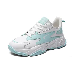 Fashionable white and mint green chunky sneakers with thick soles and lace-up closure