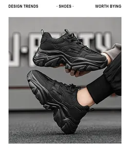 Detailed macro view of black chunky dad sneaker featuring breathable mesh and thick lug sole