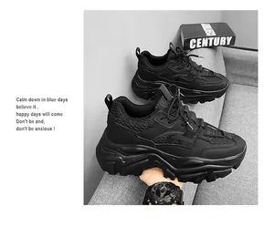Close-up of chunky black sneakers with breathable mesh upper and layered platform soles