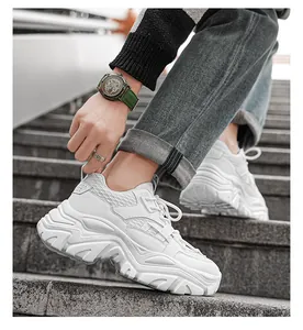 Detail of men's white platform sneaker with breathable mesh and thick sole texture
