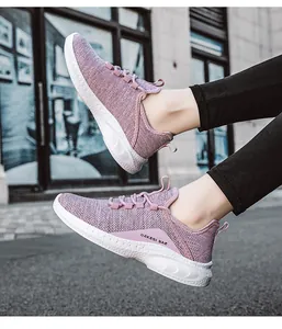 Macro shot of breathable mesh running shoes with thick white soles and purple fabric