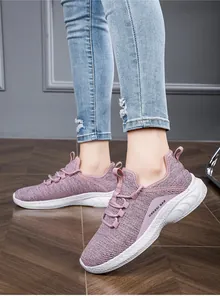 Close-up of lightweight purple mesh sneakers for women featuring breathable fabric design