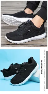 Detail view of black breathable mesh sneakers for men featuring lightweight white soles