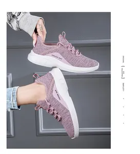 Close-up of pink mesh sneaker with breathable fabric and cushioned sole details