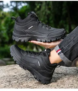Close-up of black outdoor hiking boots with non-slip rubber soles in a forest setting