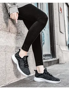 Detail of breathable knit mesh upper and cushioned thick sole on casual sneakers