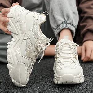 Stylish cream chunky sneakers for men with thick soles and breathable mesh paneling