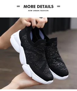 Macro detail of breathable black knitted fabric with silver glitter on slip-on sneakers