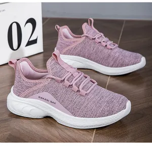 Detailed macro view of pink breathable mesh fabric and durable white anti-slip thick sole