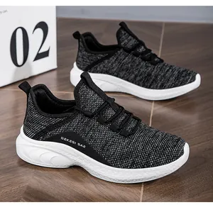 Detail of breathable knitted mesh texture and thick rubber sole on casual sneakers