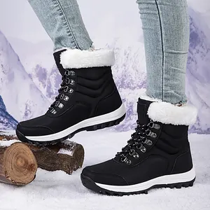 Botas de nieve negras para mujer con ribete de piel sintética y forro polar cálido