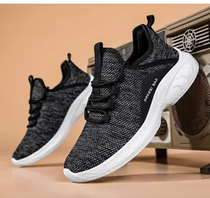 Close-up of breathable black and white fly-knit mesh upper on cushioned running shoe