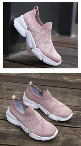 Detail of pink knitted slip-on walking shoes for women with thick white sole and breathable mesh