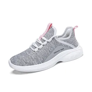 Women's breathable grey knit running shoes with soft sole and pink accents on a white base