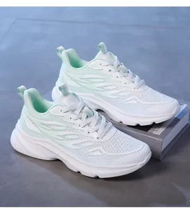Detail shot of breathable honeycomb mesh and mint green panels on women's running sneakers