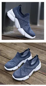 Detail of navy knit slip-on sneakers featuring white EVA soles and breathable texture