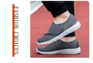 Detailed close-up of grey breathable mesh fabric and foam sole on running track
