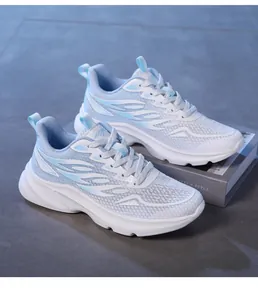 Detail of light blue mesh sneakers with breathable fabric and gradient synthetic accents