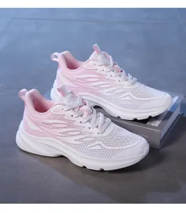 Detail of pink gradient mesh sneakers showing breathable texture and cushioning sole