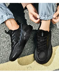 Macro detail of breathable mesh upper and durable non-slip sole on black running shoes