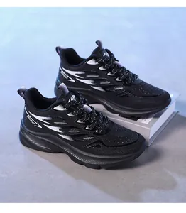 Detailed macro view of black mesh running shoes with white flame pattern and cushioned soles