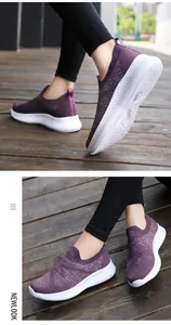 Detail of breathable purple knit slip-on sneaker with flexible white honeycomb sole