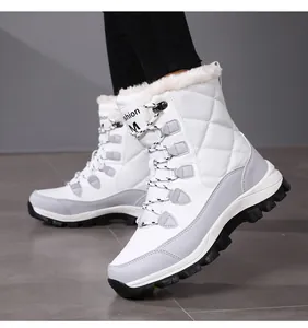 Macro view of white quilted waterproof snow boots with thick faux shearling lining