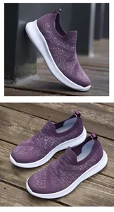 Detail of purple knitted slip-on sneakers with shimmering texture and honeycomb sole