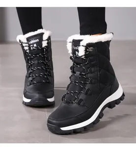 Detail view of black quilted winter snow boots with warm faux wool lining and lace-up design