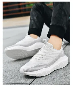 Close-up of white breathable mesh running shoes with SINCE 2038 text on tongue