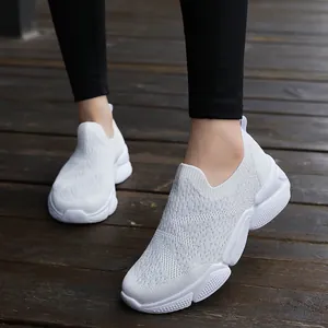 White slip-on knitted women's sneakers with thick rubber soles for daily casual wear