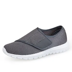 Women's breathable grey mesh walking shoes with adjustable strap and white chunky sole