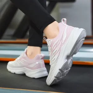 Pink and white breathable mesh women running shoes on treadmill with cushioned sole