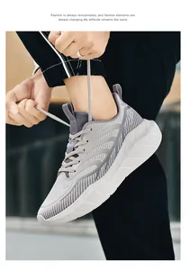 Outdoor shot of breathable grey mesh running shoes with thick cushioned white soles