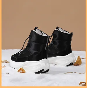 Detail of winter snow boots with plush faux fur lining and anti-slip thick soles