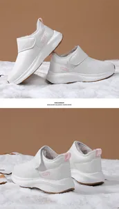 Detailed view of white snow boots with thick faux fur lining and velcro strap closure