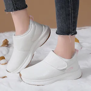 Women's white winter snow boots with textured diamond pattern and cozy warm lining