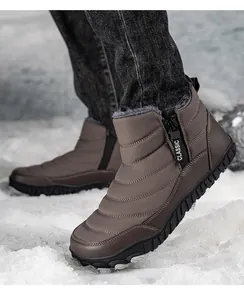Close-up of brown winter snow boots with quilted waterproof fabric and warm fur lining