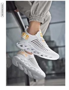 Detail of white mesh sneakers showing the breathable fabric and hollow blade damping sole