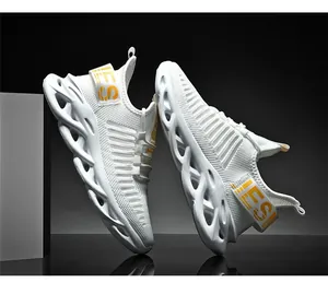 Detail of white mesh sneaker with yellow FSI webbing and hollow cushioning sole
