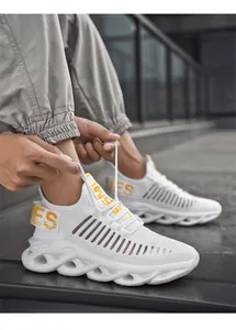 Detailed macro view of white breathable mesh upper and yellow SMILES print on sports sneaker