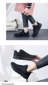 Macro detail of breathable black mesh sneakers with thick cushioned soles for daily wear
