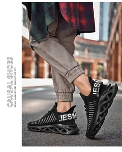 Detail of black breathable mesh sneaker featuring hollowed-out wave blade sole for men