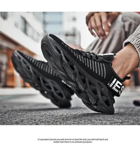 Detailed side view of the chunky hollowed wavy sole on a black mesh running sneaker