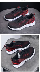 Detail of breathable black knit upper with red woven lines and thick white lightweight sole