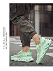 Close-up of mint green breathable mesh sneakers with chunky hollow sole on urban street
