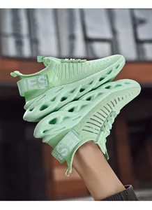 Close-up of mint green breathable woven mesh and hollow blade cushioning sole on sneakers